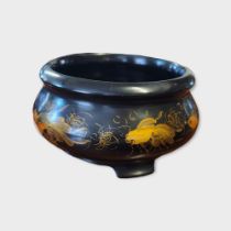 A VINTAGE JAPANESE BLACK LACQUERED SPHERICAL BOWL Painted with exotic fish on a black ground. (
