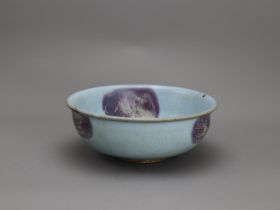 A Jun type bowl D: 20cm. With purple splashes in the turquoise glaze