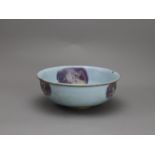 A Jun type bowl D: 20cm. With purple splashes in the turquoise glaze