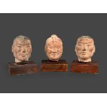 Three pottery Portrait Heads, Han dynasty (BC206 - AD220) H: 9.5cm, W: 7cm PROPERTY FROM THE COLIN