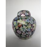 A Chinese ginger jars, 19th/20th century. H: 21cm Decorated with multi colour floral patterns on a