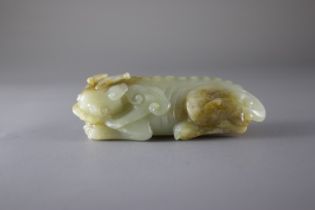 A Jade Fabulous Animal, Qing DynastyL: 9.2cm A Jade Fabulous Animal, Qing dynasty Carved as a