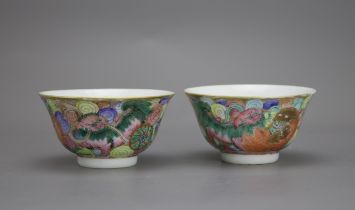 A Pair of 'Lion and Ball' Bowls, Qianlong marks, Qing Dynasty W: 8.8cm Amusingly painted in