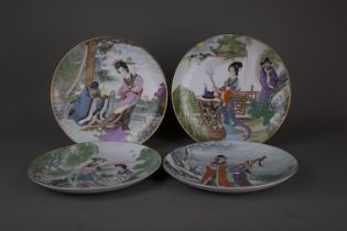 Four Chinese cabinet porcelain plate, 20th century. D: 21.5cm Each of the plates depict a beauty
