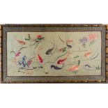 A Chinese embroidery on silk, 20th C. Size: 72x38cm Depicting fish swimming among lotus, lily