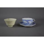 A Chinese jade tea cup and a Japanese tea cup and saucer, Meiji period. H: 6.5cm Bell shaped with an