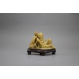 A Reclining Soapstone Figure of Liuhai, c. 1900L: 11.2cm A Reclining Soapstone Figure of Liuhai,