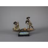 A large and heavy Chinese brass figure group sculpture, 19th / 20th century. H: 26cm Depicts two