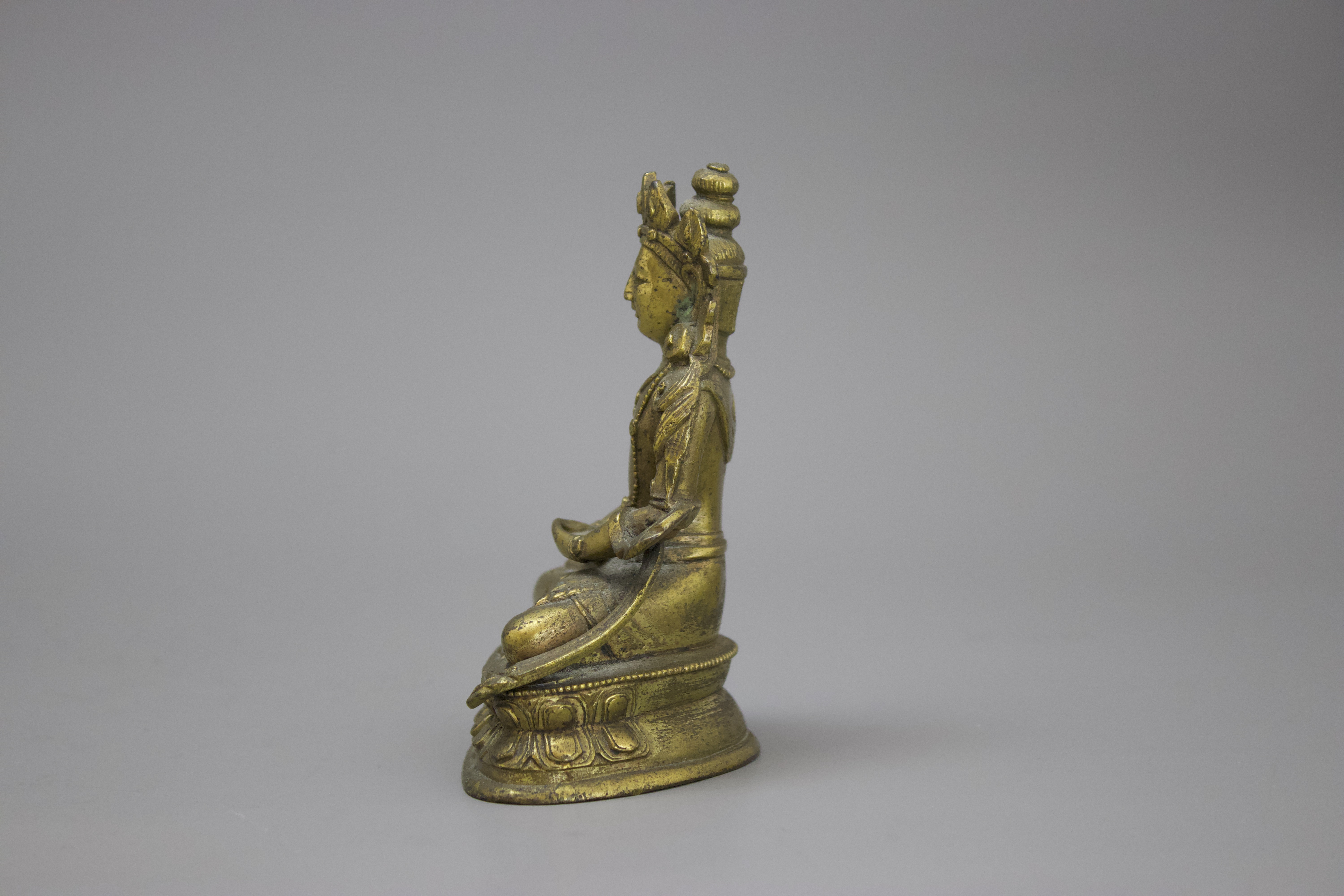A Gilt Bronze Amitayus, c. 1800 H: 10cm well cast with some chased detail, seated on a waisted lotus - Image 3 of 6