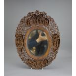 A carved fruitwood Mirror Frame, 19th century H: 38cm, W: 28.5cm of shaped oval form, well carved