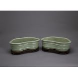 A Pair of Celadon Narcissus Jardinieres, six character seal marks of Qianlong, c. 1900 L: 25.5cm, W: