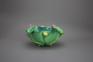 A 'famille rose' Lotus Waterpot, 19th century W: 23cm The bowl cleverly shaped as a lotus leaf, with