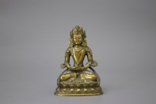 A Gilt Bronze Amitayus, c. 1800 H: 10cm well cast with some chased detail, seated on a waisted lotus