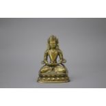 A Gilt Bronze Amitayus, c. 1800 H: 10cm well cast with some chased detail, seated on a waisted lotus