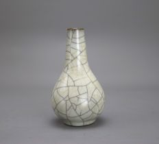 A Ge type bottle Vase H: 13.3cm the pear shaped body with soft greyish glaze, covered in a fine