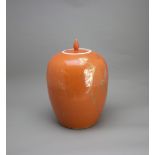 A coral glazed ovoid Jar and Cover, early 20th CenturyH: 32cm overall PROPERTY FROM THE COLIN HART