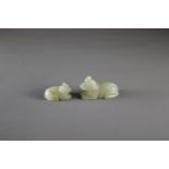Two small celadon Jade Dogsthe larger L: 4cm Two small celadon Jade Dogs Carved in Yuan style,