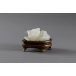 A white Jade Cat, 18th CenturyL: 3.2cm A white Jade Cat, 18th century carved in reclining posture,