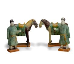 Two sancai glazed pottery Horses, with two sancai Grooms, Ming dynasty The horses H: 23.5cm, L:
