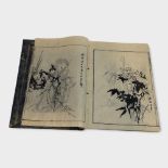 A JAPANESE BOOK OF BLACK AND WHITE PRINTS Various traditional images of landscapes and figures. (