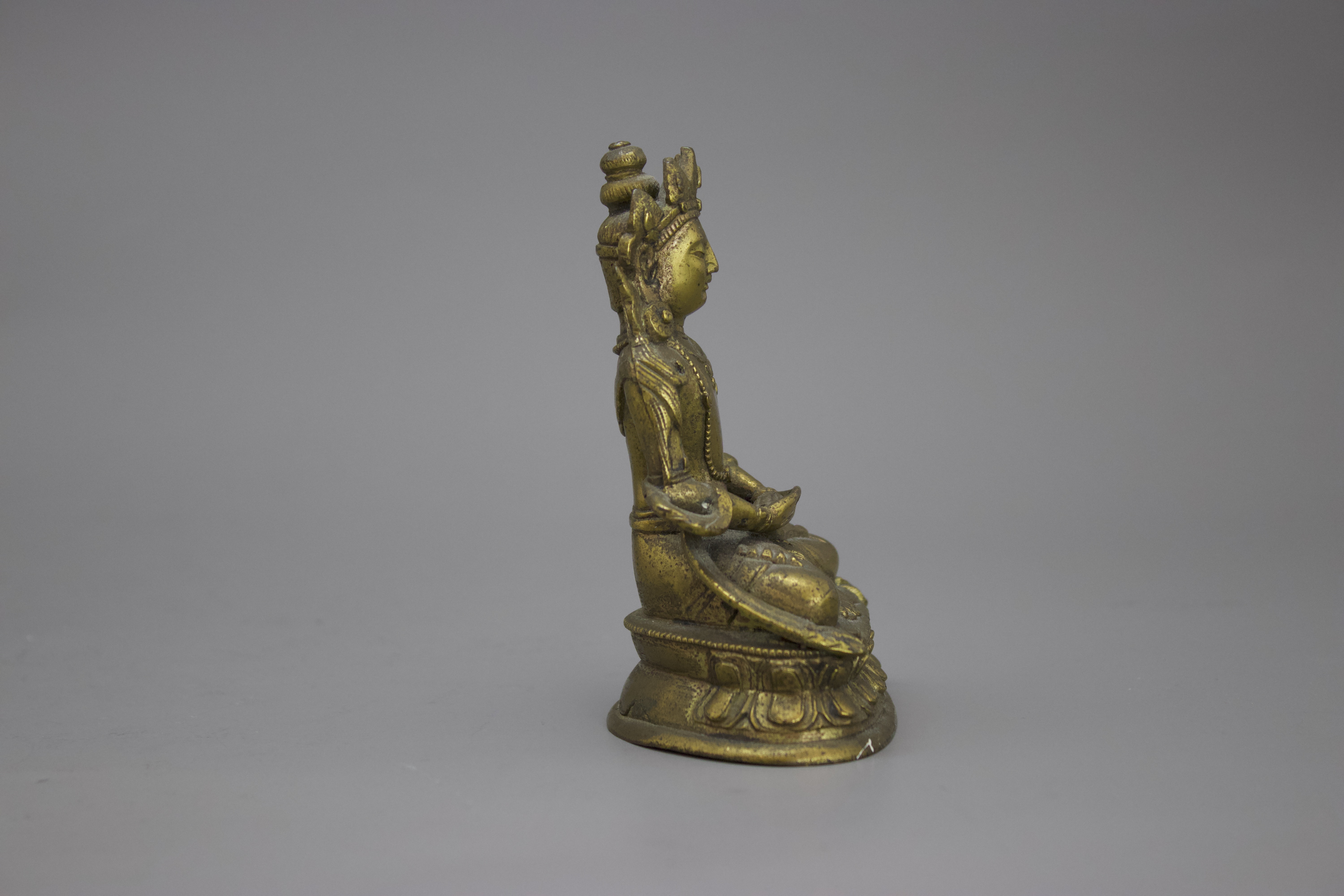 A Gilt Bronze Amitayus, c. 1800 H: 10cm well cast with some chased detail, seated on a waisted lotus - Image 4 of 6