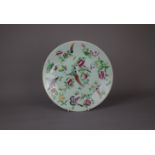 A Chinese famille rose porcelain plate, 19th century. H:26cm The plate is decorated with fruit,