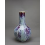 A large flambe Bottle Vase, c. 1800 H: 40cm, W: 25cm PROPERTY FROM THE COLIN HART COLLECTION The
