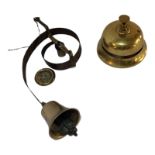 A VICTORIAN BRASS BUTLER’S BELL Together with a vintage brass shop counter or reception bell. (
