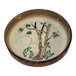 CLARICE CLIFF, AN ART DECO PERIOD NOVELTY TREE PATTERN LADIES' CIRCULAR PIN TRAY The border