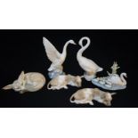 A MIXED SELECTION OF LLADRO PORCELAIN ANIMALS FIGURES To include two country cows, a fox group, swan