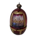 A FINE 20TH CENTURY FABERGÉ STYLE CUT CRANBERRY GLASS GILDED TWO SECTION EGG St. Petersburg