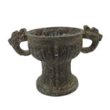 A CHINESE ARCHAIC STYLE BRONZE TWO HANDLED CENSER Decorated with Chinese symbols. (h 20cm x 19cm)