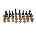 AN EARLY 20TH CENTURY BOXWOOD AND EBONY COMPLETE CHESS SET Some pieces, stamped with red and dark