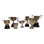 A COLLECTION OF SEVEN EARLY 20Th CENTURY AND LATER SILVER TENNIS TROPHIES To include two