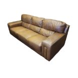 A CONTEMPORARY TAN LEATHER UPHOLSTERED THREE SEAT SETTEE. (222cm x 96cm x 78cm) Condition: good