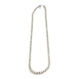 A 14CT WHITE GOLD AND DIAMOND NECKLACE Having a single row of graduated round cut diamonds. (