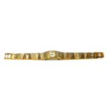 AVIA, A VINTAGE BICOLOUR GOLD PLATES LADIES’ WRISTWATCH On an integral bracelet strap, in original