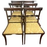 A SET OF SIX REGENCY PERIOD FAUX ROSEWOOD DINING CHAIRS With pierced and carved bar backs and