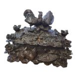 A FINE 19TH CENTURY BAVARIAN BLACK FOREST RECTANGULAR CASKET AND COVER Exceptionally well carved,