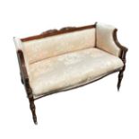 A LATE VICTORIAN/EDWARDIAN MAHOGANY TWO SEAT SETTEE Having scrolled arms and padded back, the