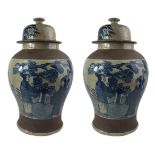 A PAIR OF LARGE CHINESE CRACKLE GLAZED BLUE & WHITE TEMPLE JARS Decorated with court scenes, brown