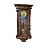 A 19TH CENTURY AUSTRIAN WALNUT VIENNA RECTANGULAR WALL CLOCK With carved column supports and