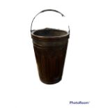 A LARGE MAHOGANY AND METAL PEAT BUCKET The Gothic panelled sides furnished with a brass swing