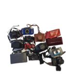 A LARGE QUANTITY OF VINTAGE CAMERAS Including Praktica and Zenit, Polaroid and many Box Ensign