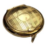 AN ART DECO PERIOD 9CT GOLD LADIES’ POWDER CIRCULAR COMPACT With engine turned decoration, stamped