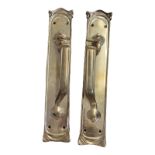 A PAIR OF ART NOUVEAU PERIOD HEAVY BRASS DOOR HANDLES Embossed with sinuous foliage and stylised