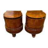 A PAIR OF ART DECO PERIOD FIGURED WALNUT BOW FRONTED BEDSIDE CABINETS With single doors, raised on