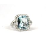 AN 18CT WHITE GOLD LARGE AQUAMARINE & DIAMOND DRESS RING, with WGI certificate. (Approx Aquamarine