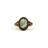 A 9CT VINTAGE ROSE GOLD RING SET WITH CARVED CAMEO.