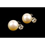 A LARGE PAIR OF 18CT WHITE GOLD, PEARL AND DIAMOND EARRINGS Having brilliant round cut diamonds.